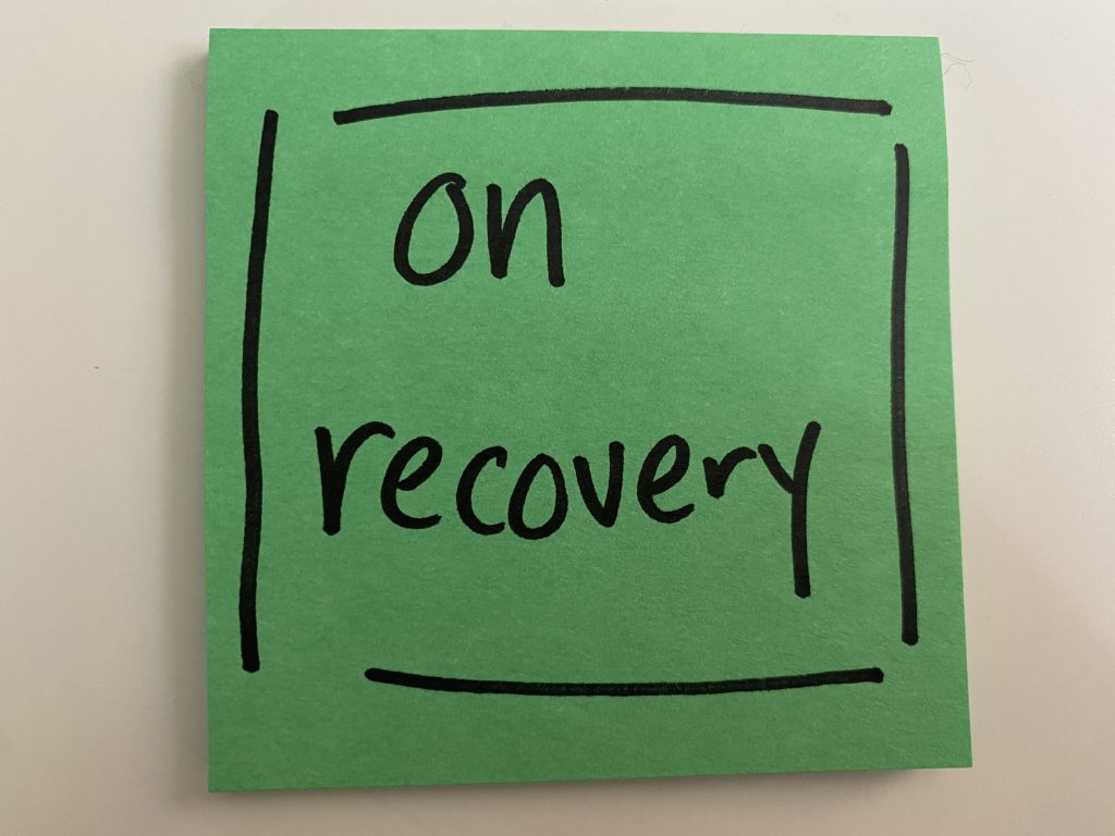 post-it that says "on recovery" in black sharpie